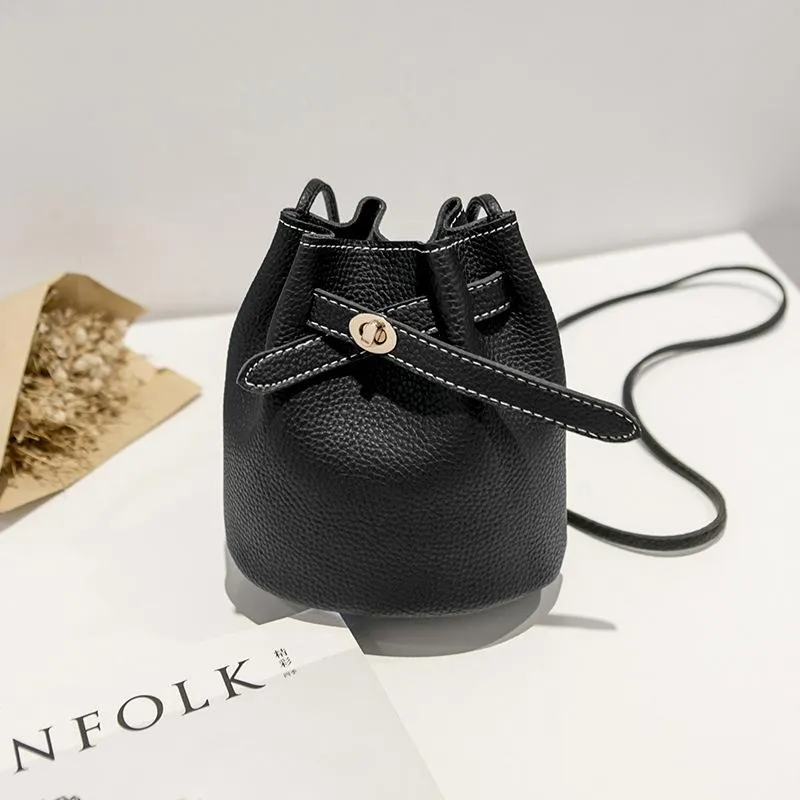 Guangzhou supply 2024 new simple bucket bag wide-band lock small bag Korean version casual solid color single shoulder